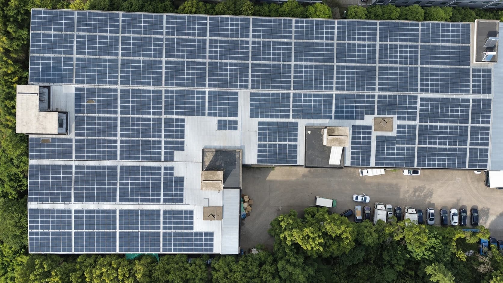Aerial view of solar panels covering the Airsun factory rooftop.